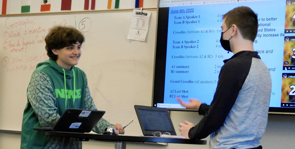 View Ridge Middle School students (L to R) Keegan Wallace and Bennett Anderson debate in the second round of crossfire