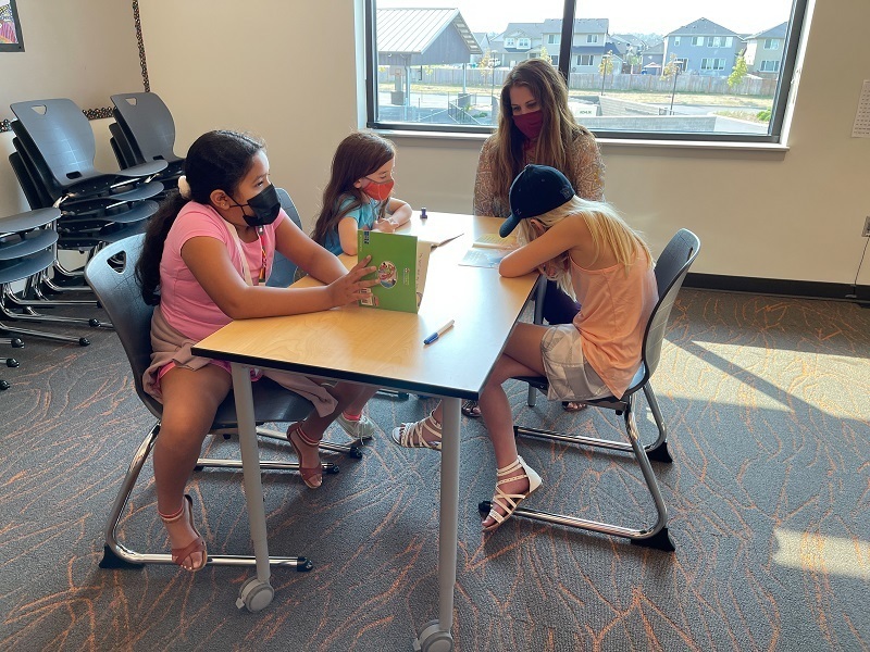 Teacher Sonia Greenway leads students through a reading project