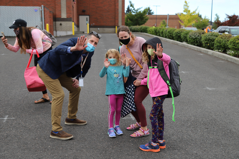 Ridgefield Superintendent Dr. Nathan McCann greets Amanda Ronstadt and her children, Vitiana and Raleigh, as they arrive at school