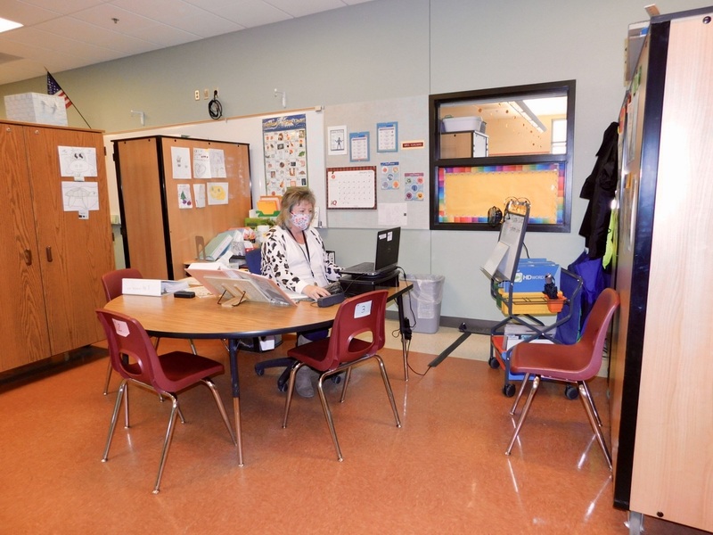 What was an open and airy common area in the newer building is now crowded with makeshift offices for specialized learning programs