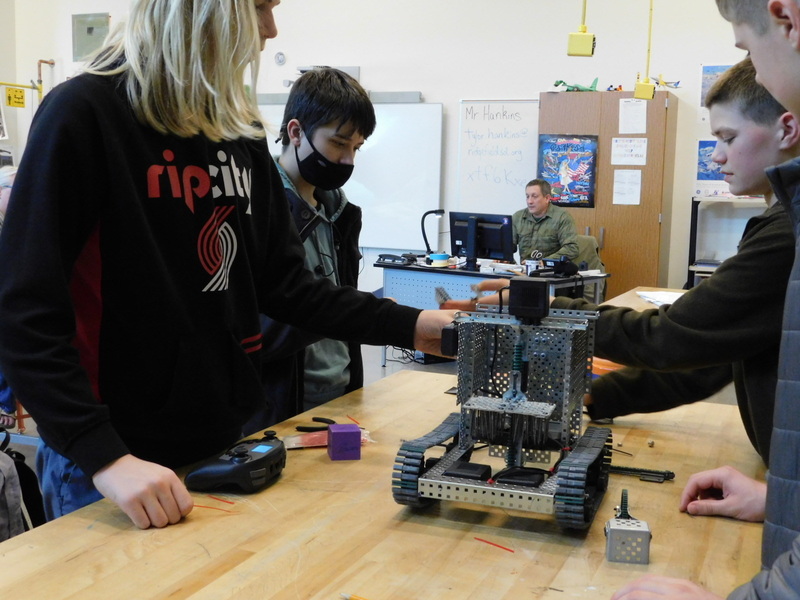 (L to R) Jonah Wright, Hunter Nelson, Ronan Zabinski, and Westin Walker fine tune their robot’s ability to collect and move samples